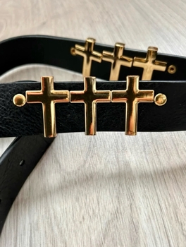 Black leather belt with gold accents