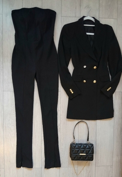 Musta jumpsuit ja bleiseri