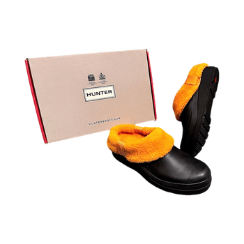 Black clogs with orange fleece