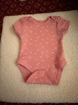 Pink floral baby bodysuit