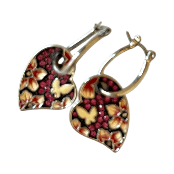 Silver color hoop earrings with floral charms
