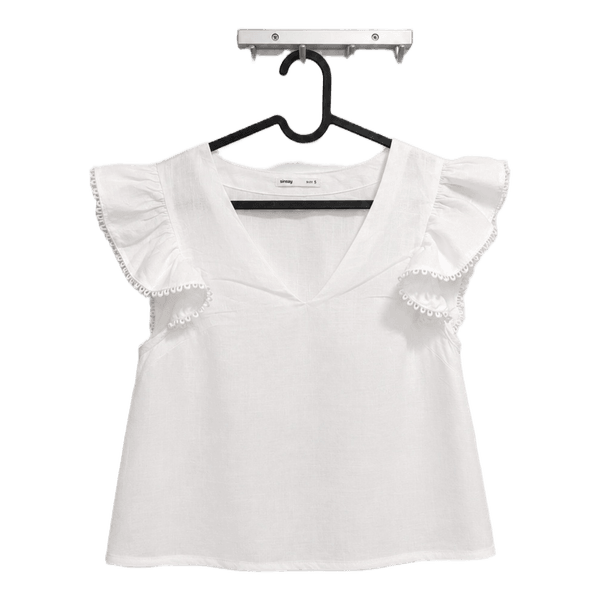 White ruffle blouse