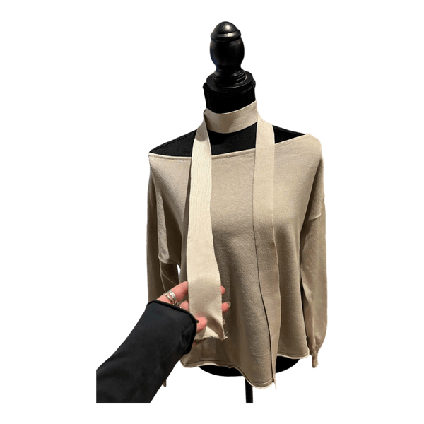 Beige off-shoulder sweater with a scarf