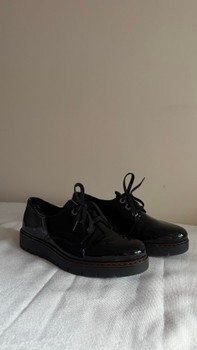 Black patent lace-up shoes