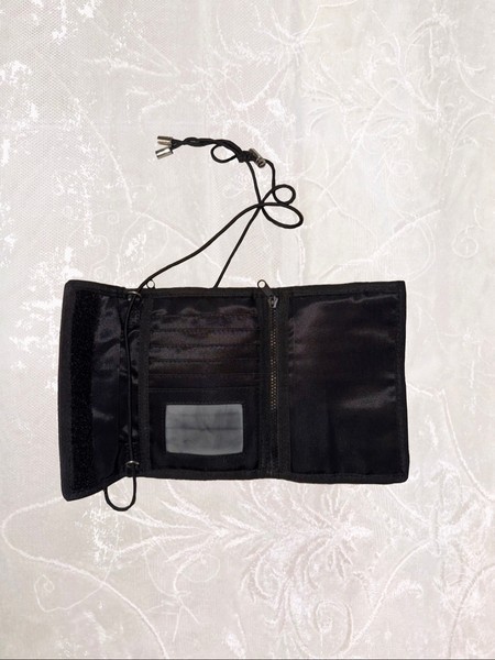 Black wallet with a long adjustable strap