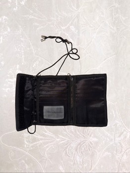 Black wallet with a long adjustable strap