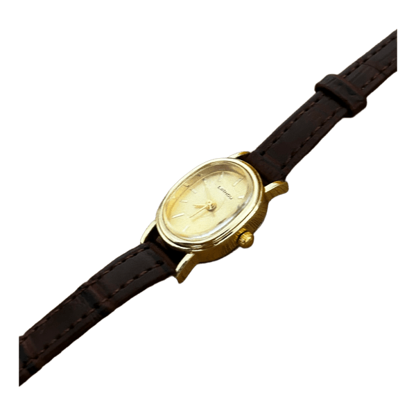 Gold oval watch