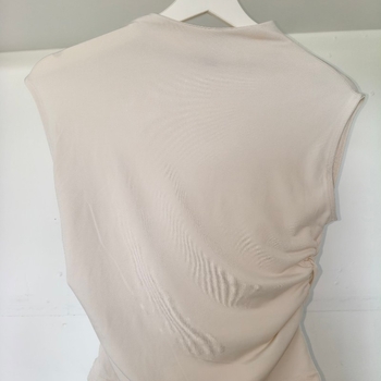 beige sleeveless top