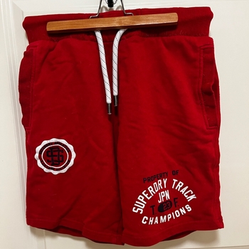 Punaiset Superdry collegehousut miehille