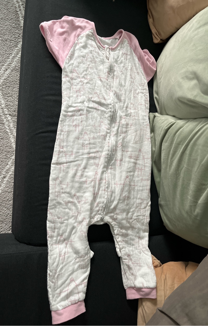 White and pink baby sleepsuit