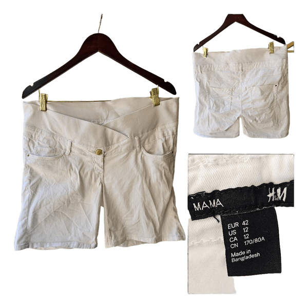 K: 42 valkoiset shortsit naisten housut