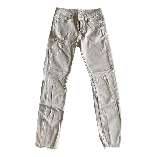 Very light beige distressed denim jeans