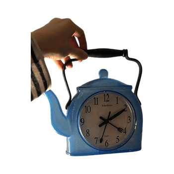 Blue teapot-shaped clock