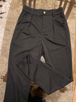 Black trousers with gold button