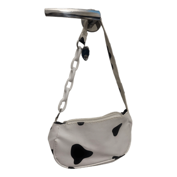 Lehmäkuvioinen laukku