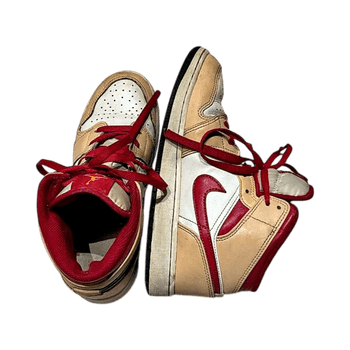 Red and beige jordans 