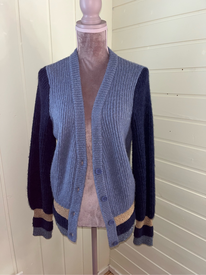 Blue knitted cardigan with gold cuffs
