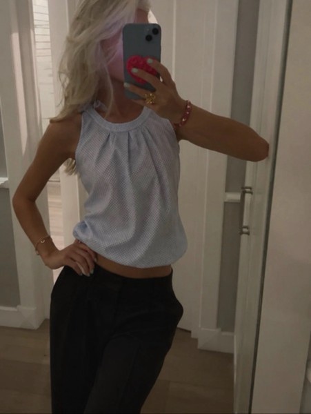 Light blue sleeveless blouse