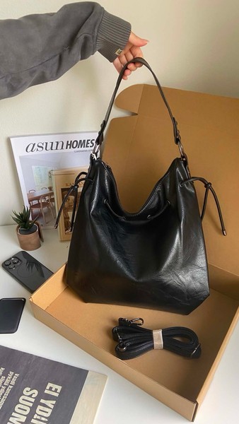 Black faux leather handbag