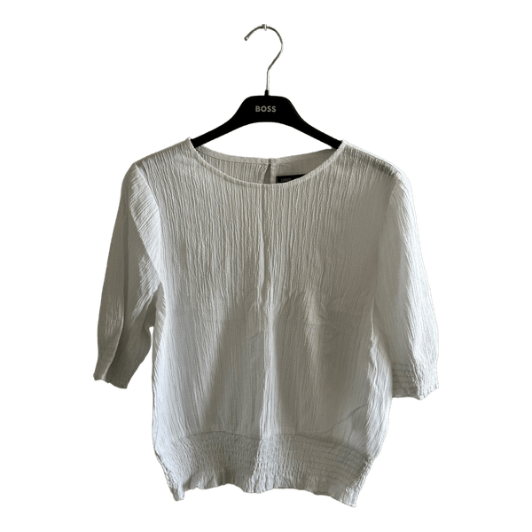 White pleated blouse