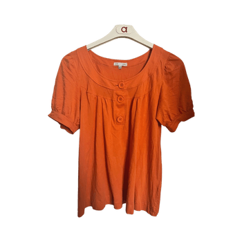 Oranssi napillinen pusero