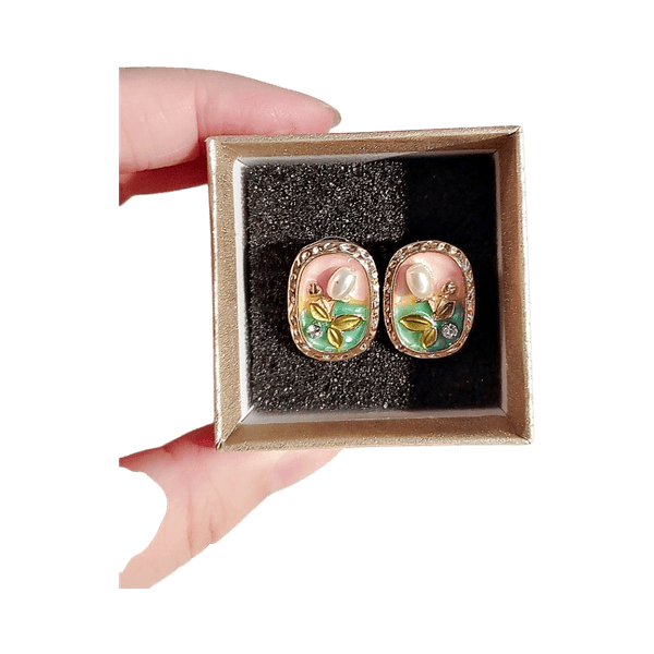 Gold tone floral stud earrings