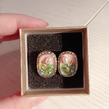 Gold tone floral stud earrings