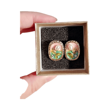 Gold tone floral stud earrings