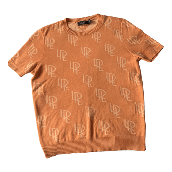 Orange monogram knit top