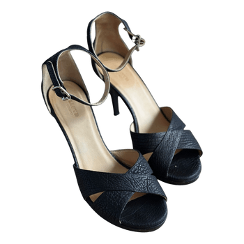 Black leather heeled sandals