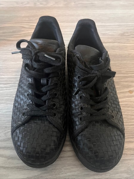 Black woven Adidas sneakers