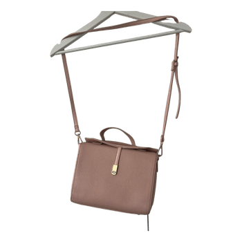 Vaaleanpunainen olkalaukku