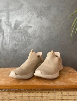 Beige Skechers slip-ins