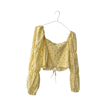 Keltainen kukkakuvioinen pusero