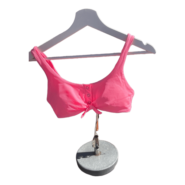 Vaaleanpunainen bikiniyläosa