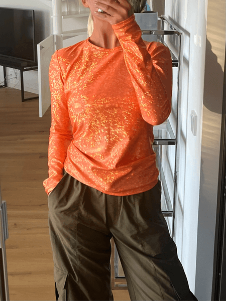 Saks Potts orange shimmer top