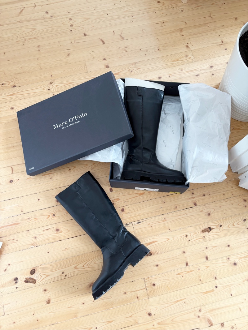 Black leather knee boots