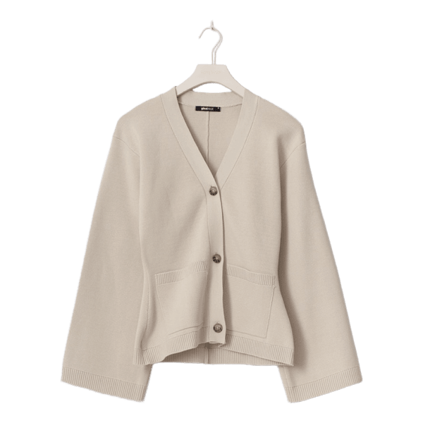 Beige neuletakki napeilla