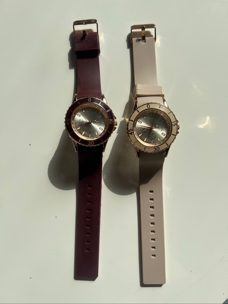 Two analog wristwatches