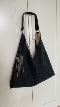Handmade hobo bag with fringe accents