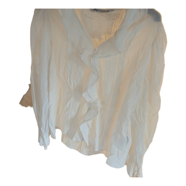 White ruffle blouse