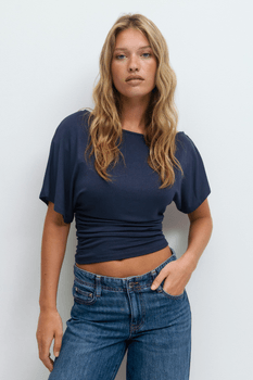 Sloped shoulder top