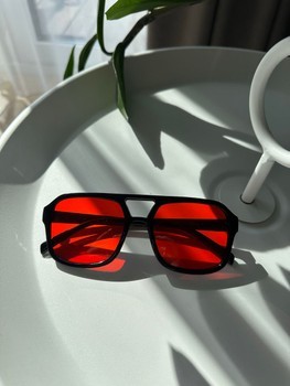 Black sunglasses with red lenses