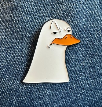 Skeptical duck enamel pin
