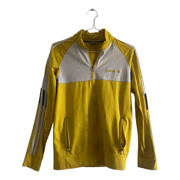 Keltainen Adidas verryttelytakki