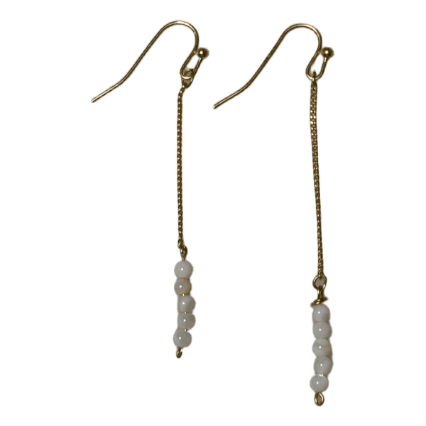 Gold hoop earrings with white glass beads