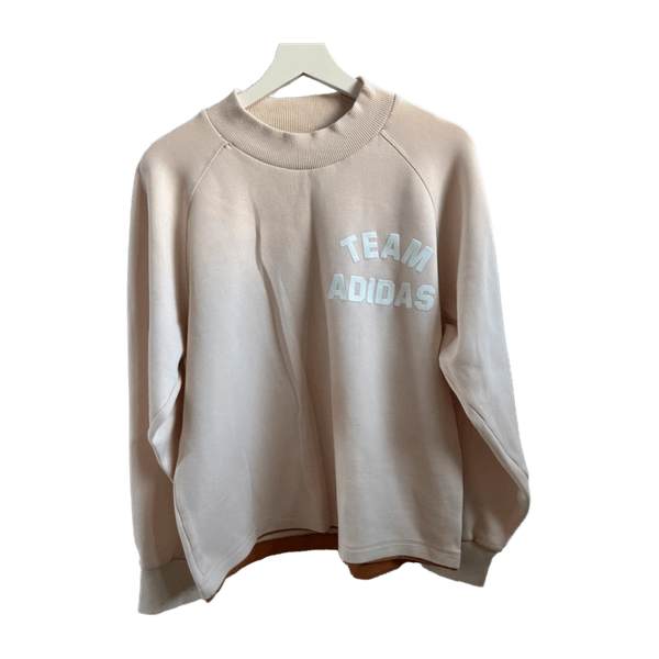 Vaaleanpunainen adidas collegepaita