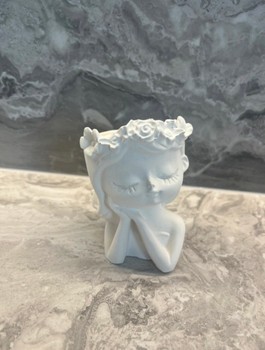 White floral head statue