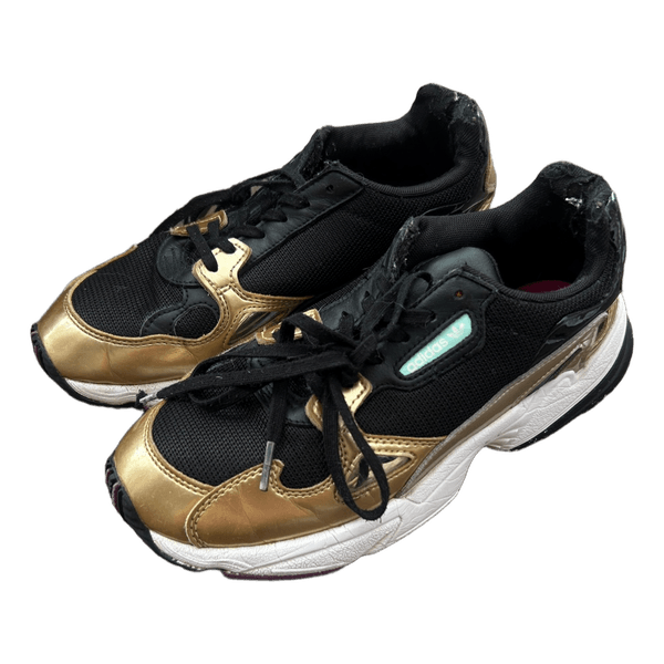 Adidas Falcon black gold sneakers
