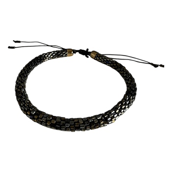 Tumma kimaltava kaulakoru